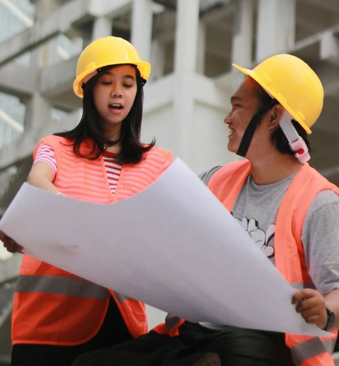 man and woman holding white paper